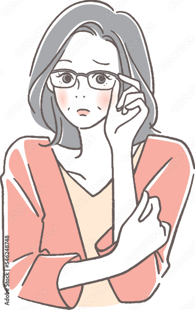 メガネをかけた困った顔のシニア女性