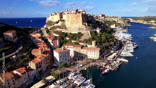 Bonifacio town on the rocks, Corsica island. aerial drone video view.  popular tourist destination, France

