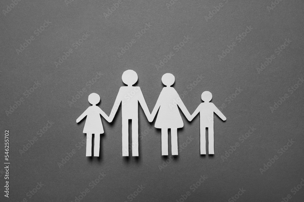 Paper family figures on grey background, top view. Insurance concept Paper family figures on grey background, top view. Insurance concept