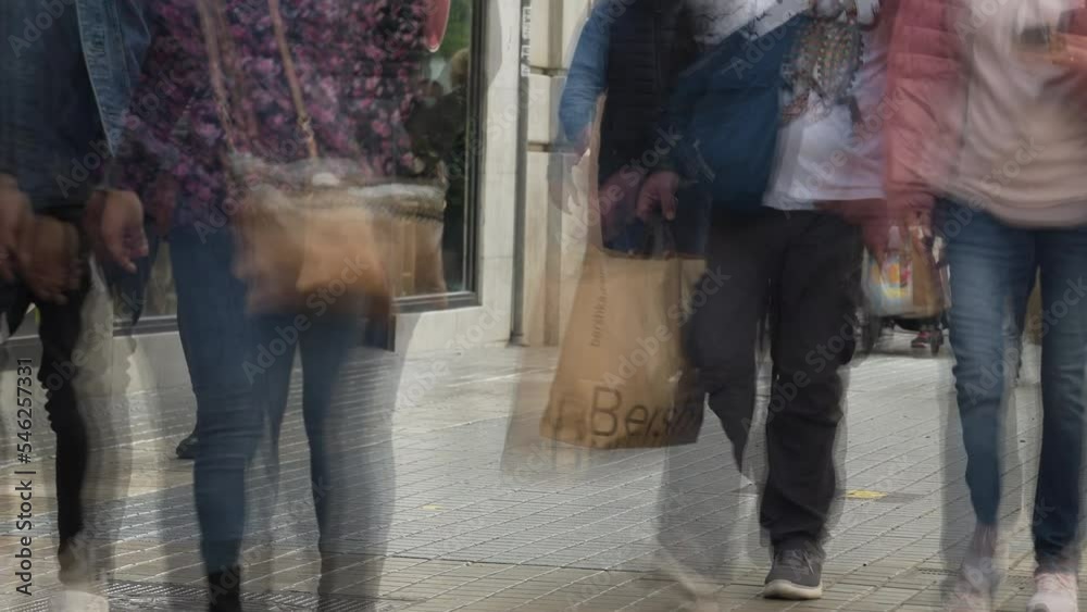 Pedestrians walking on the sidewalk in the city center of Valencia, Spain. Timelapse. Pedestrians walking on the sidewalk in the city center of Valencia, Spain. Timelapse.