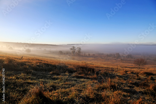 foggy morning landscape with sunrise
