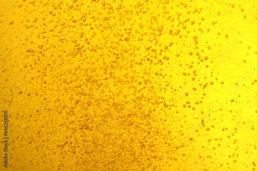 Tasty beer with bubbles as background, closeup Tasty beer with bubbles as background, closeup