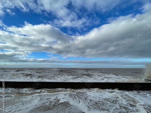 Huge waves crashing over the sea wall. Taken in Blackpool Lancashire England.  photo