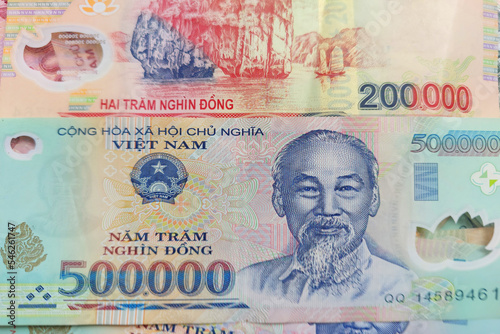 Vietnamese dong banknotes close-up. Money background. Vietnamese currency - dongs. Pattern texture and background of Vietnam dong money, currency banknotes ready for exchange and business investment photo