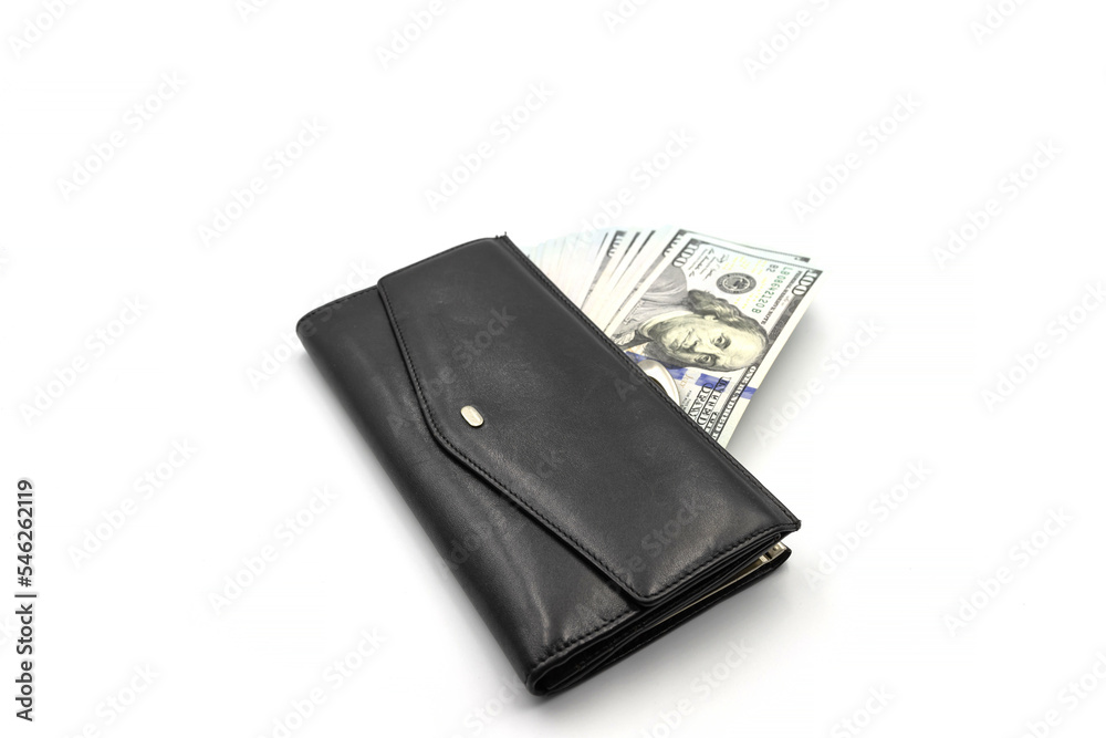 Cash from one hundred dollar bills in a wallet on a white background. A lot of US dollars in a black wallet. Cash from one hundred dollar bills in a wallet on a white background. A lot of US dollars in a black wallet.