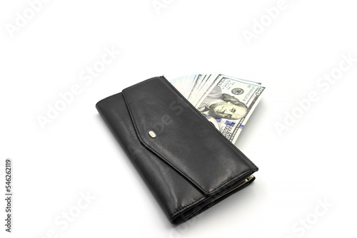 Cash from one hundred dollar bills in a wallet on a white background. A lot of US dollars in a black wallet.