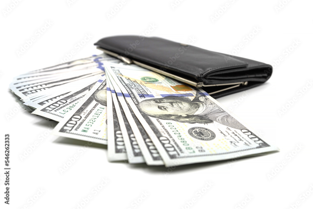 Cash from one hundred dollar bills in a wallet on a white background. A lot of US dollars in a black wallet. Cash from one hundred dollar bills in a wallet on a white background. A lot of US dollars in a black wallet.