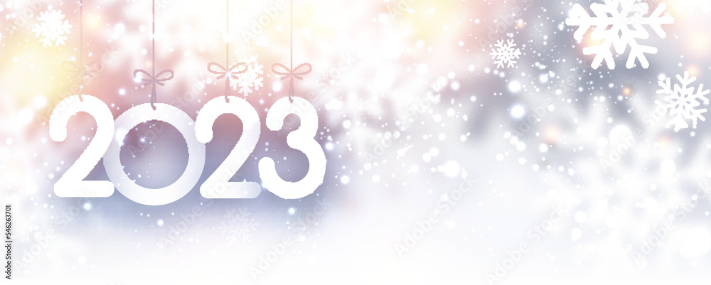 Hanging 2023 sign with snowflakes and copy space.