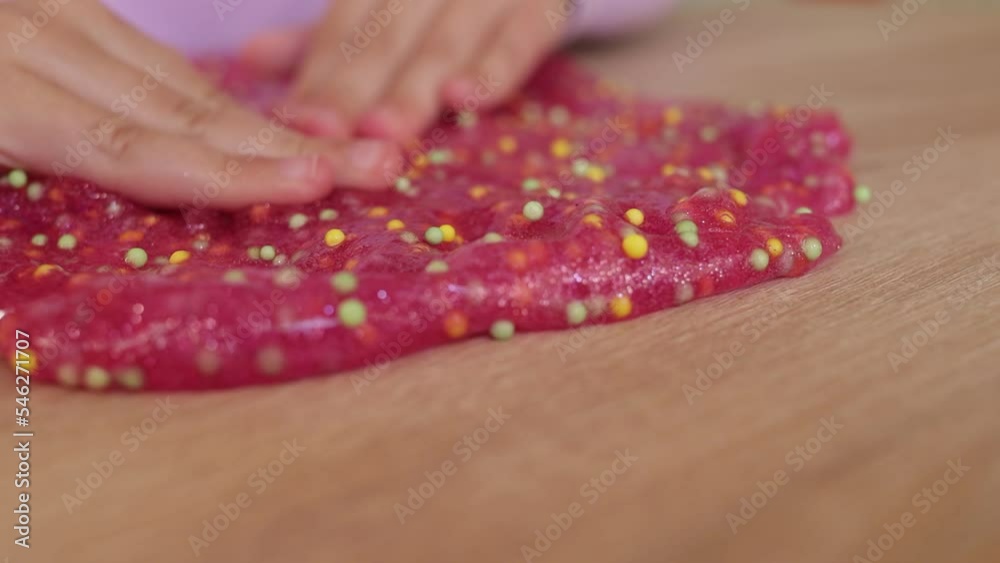 Kid playing with slime, child development concept