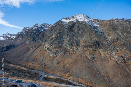 Mountain asphalt road high in rocky mountains.