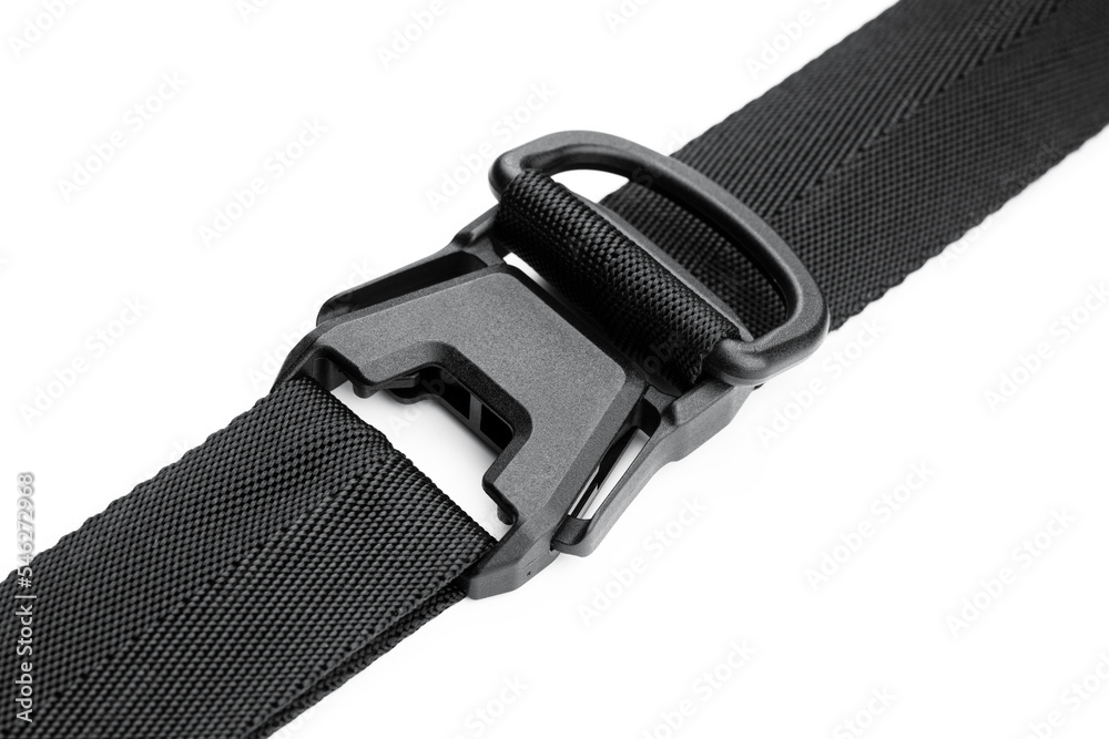 Black plastic fastener fastex for the manufacture of backpacks. Plastic belt clip, carbine - buckle, length adjusters on bag or backpack strap. Fastex buckle on textile belt on white background. Black plastic fastener fastex for the manufacture of backpacks. Plastic belt clip, carbine - buckle, length adjusters on bag or backpack strap. Fastex buckle on textile belt on white background.