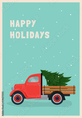 A red retro pick up car is carrying a Christmas tree on a blue background it is snowing Merry Christmas and holidays