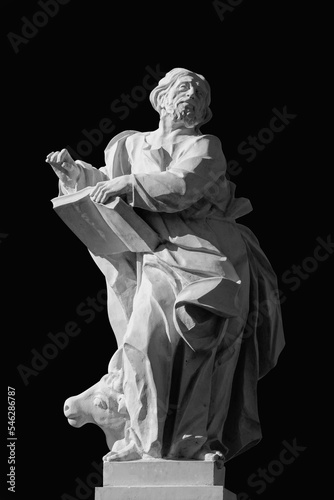 Canvas Print Ancient stone statue of Evangelist Saint Luke