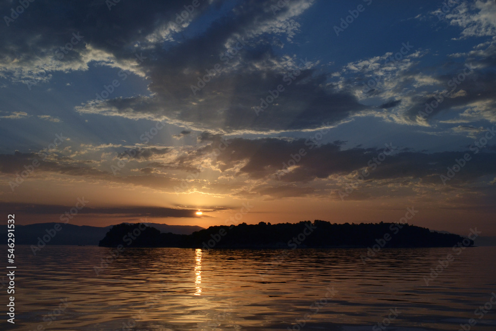 Fototapeta premium View of Lazareto island from a sailboat during sunrise.