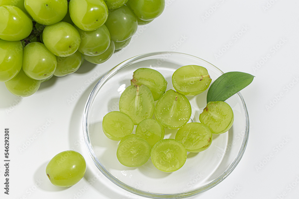 Cut Shine Muscat grapes on a white background. Cut Shine Muscat grapes on a white background.