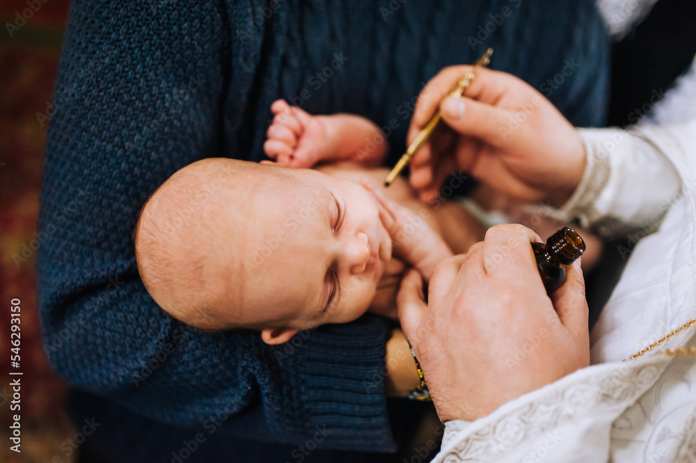 The priest in the church conducts a sacred rite, the ritual of ...