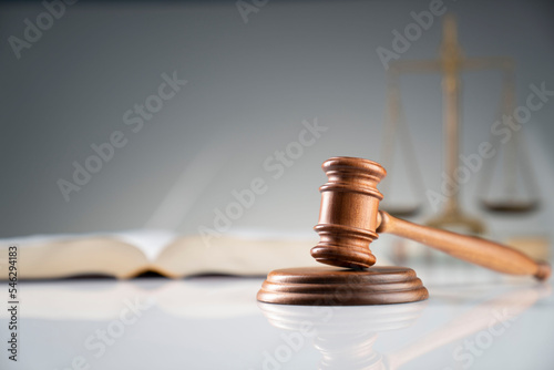 Law and justice concept. Judge office – gavel and legal code on white desk.