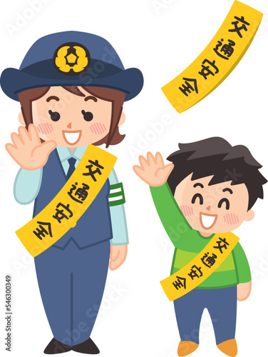 笑顔で手を振る婦警さんと男の子　交通安全