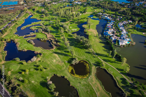 Aerial view of the salt marshes of the Camargue in southern France with plush beautiful golf course of la Grande Motte just beside the Mediterranean Sea photo