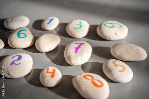 Colorful stones signed by numbers, an alternative method of children education. Number 7 in center