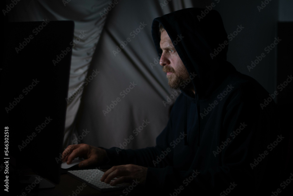 Hacker in the dark room on the pc Hacker in the dark room on the pc