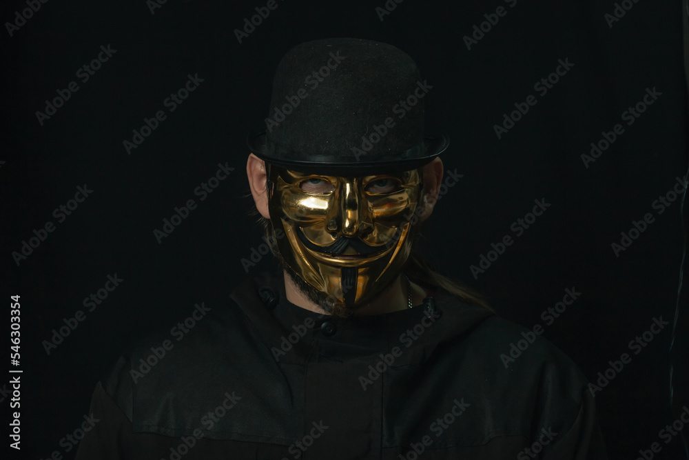 Scary figure with creepy mask and hat in the dark Scary figure with creepy mask and hat in the dark