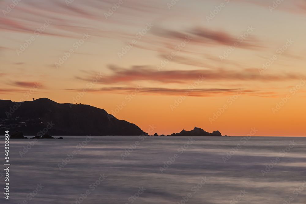 Silhouette of San Francisco Bay Area Oceanside Cliffs During Sunset