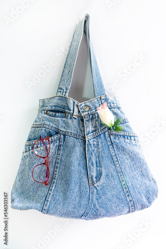 Denim bag made from old jean over white background