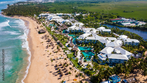aerial drone shot of a beach on Punta Cana on a beautiful sunny day. the ocean with a crystal blue color that tourist love during vacation  © ezellhphotography