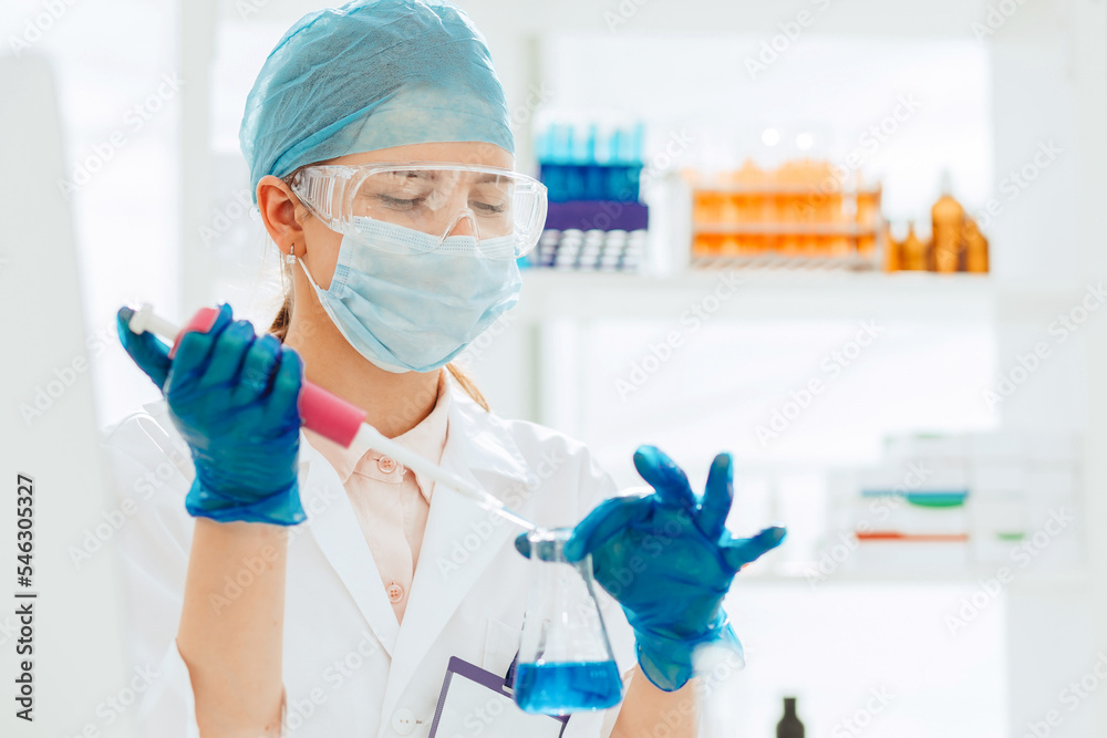 female laboratory assistant conducts blood tests in the laboratory female laboratory assistant conducts blood tests in the laboratory