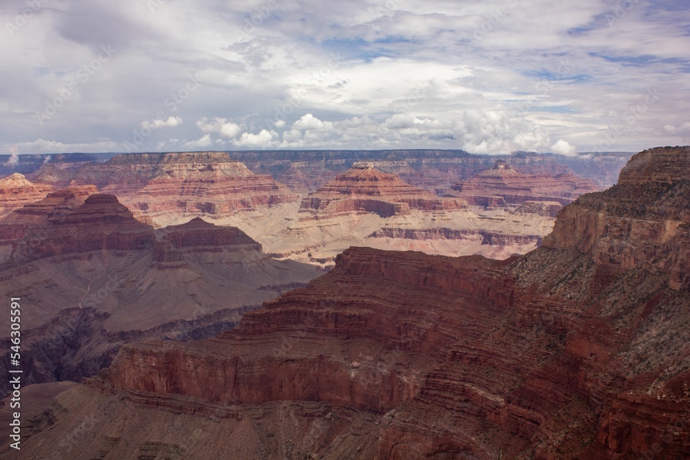 Magnificent view of a gorge in Grand Canyon National Park, in Arizona, with beautiful clouds Magnificent view of a gorge in Grand Canyon National Park, in Arizona, with beautiful clouds
