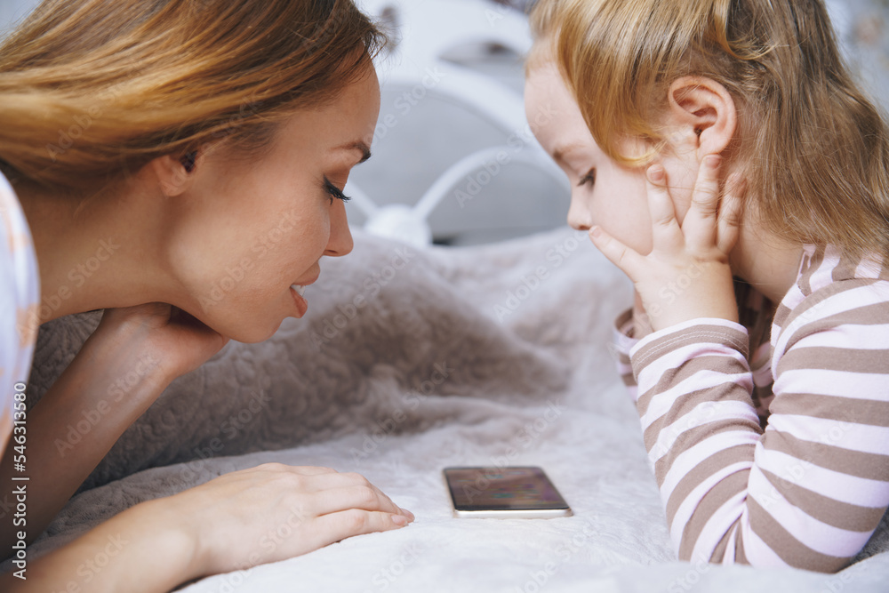 Mother and daughter using smartphone Mother and daughter using smartphone