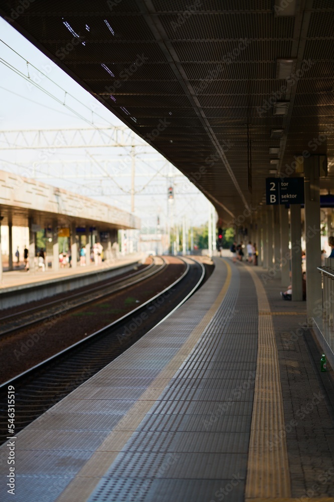 Vertical shot of the Gdansk Wrzeszcz empty railway station, view of the platform in the daylight