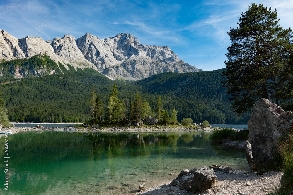 Fototapeta premium Beautiful shot of a calm lake with the background of mountains