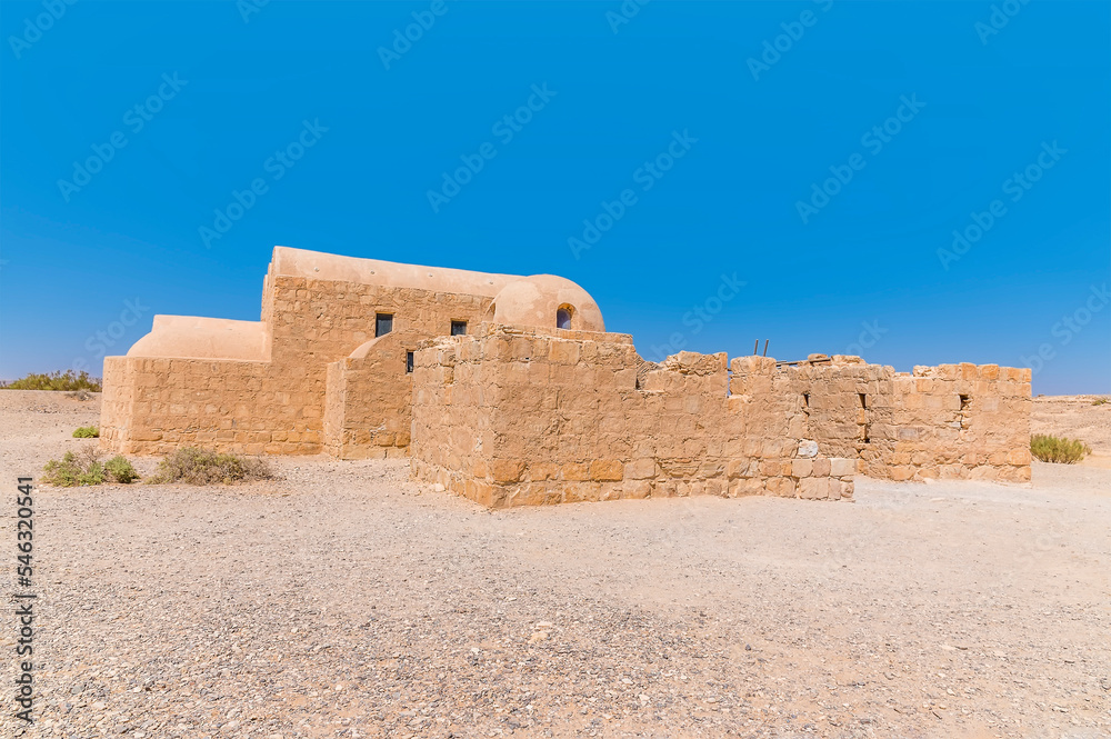A side view across an old castle in the desert east of Amman, Jordan in summertime