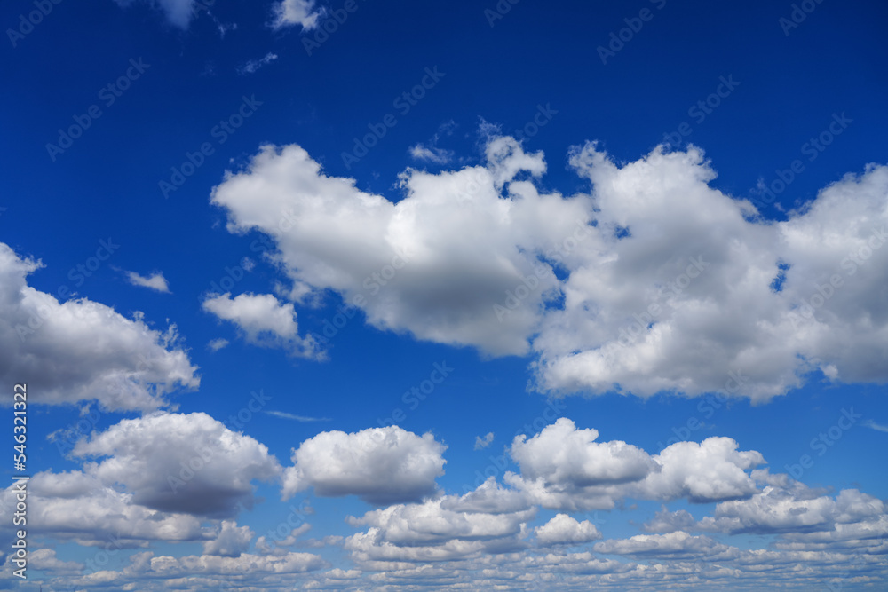 Blue sky with fluffy white clouds. Nice weather. Background.
Blue sky with fluffy white clouds. Nice weather. Background.