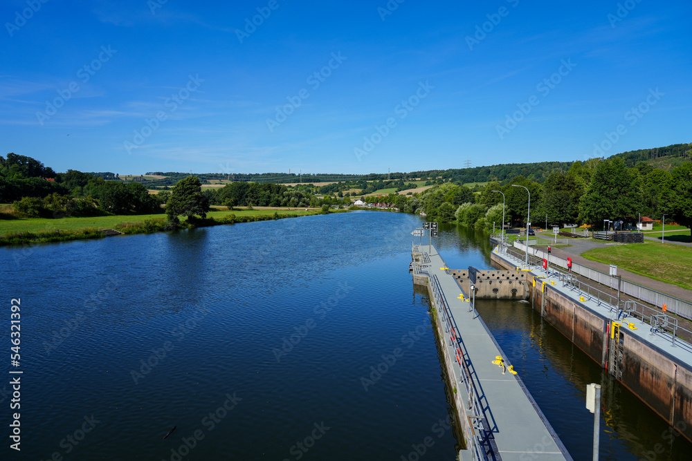 View of the Wilhelmshausen lock in the Fulda valley in Hesse. Landscape at the Fulda with the surrounding nature.
