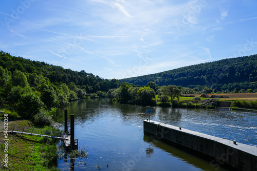 View of the Wilhelmshausen lock in the Fulda valley in Hesse. Landscape at the Fulda with the surrounding nature. 