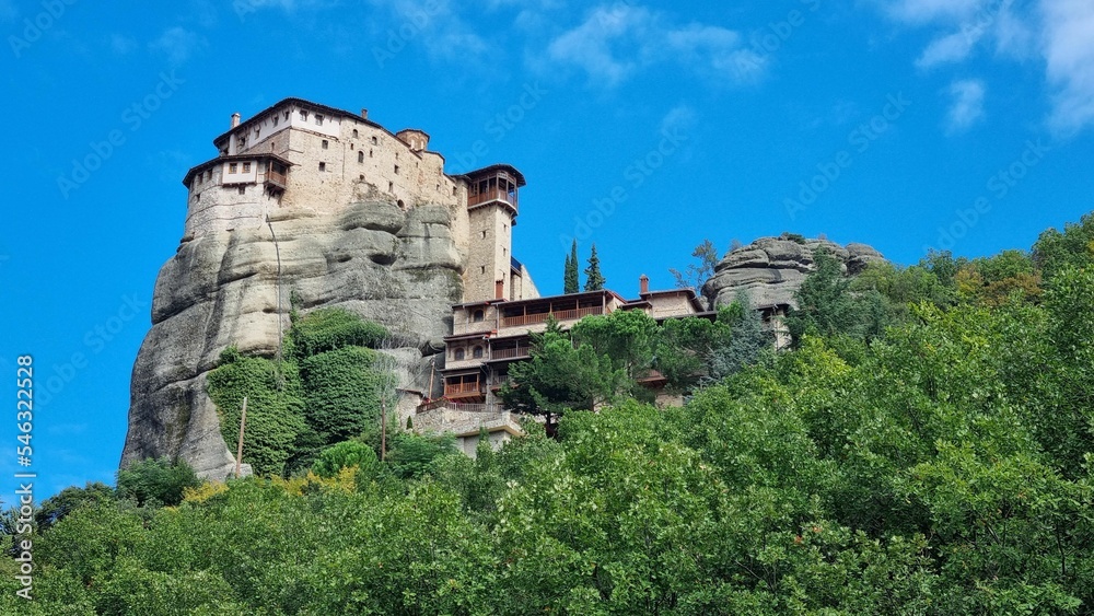 Low angle shot of the Holy Monastery of Rousanos Saint Barbara building on top of a hill