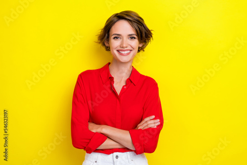 Photo of pretty adorable nice gorgeous woman with bob hairstyle wear red shirt standing hands crossed isolated on yellow color background