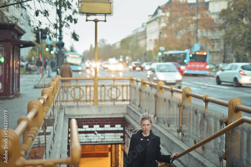 Photography young woman exits a subway in Budapest