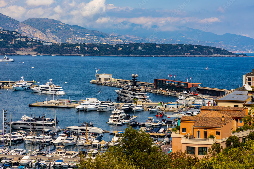 Panoramic view of Monaco metropolitan area with Hercules Port and Monte Carlo quarter at Mediterranean Sea coast Panoramic view of Monaco metropolitan area with Hercules Port and Monte Carlo quarter at Mediterranean Sea coast
