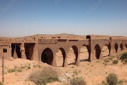 Ruins of old bridge over river Moulouya between Zaida and Aouli in Morocco photo