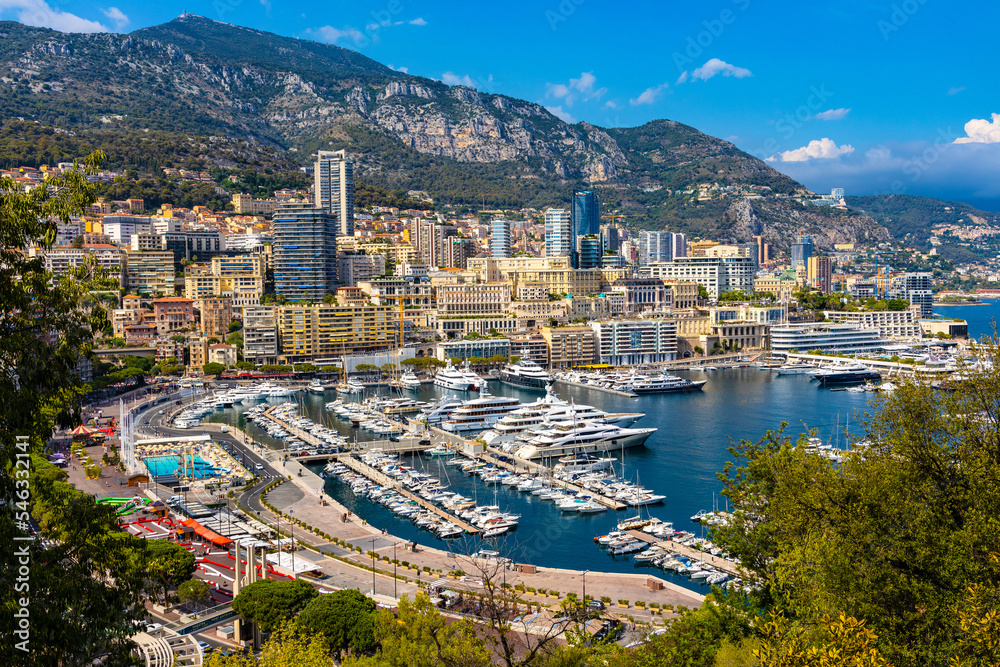 Naklejka premium Panoramic view of Monaco metropolitan area with Hercules Port, La Condamine, Monte Carlo and Fontvieille quarters at Mediterranean Sea coast