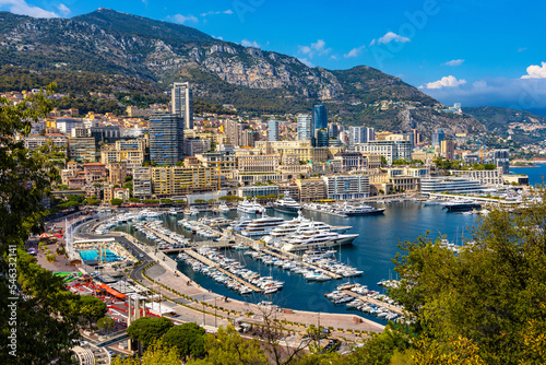 Panoramic view of Monaco metropolitan area with Hercules Port, La Condamine, Monte Carlo and Fontvieille quarters at Mediterranean Sea coast photo