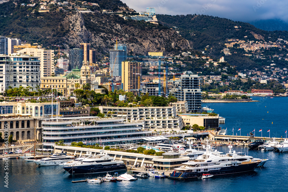 Panoramic view of Monaco metropolitan area with Hercules Port, Monte Carlo and Fontvieille quarters at Mediterranean Sea coast