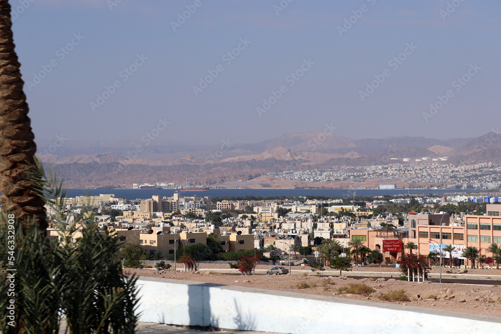 Jordan - Aqaba city buildings and Eilat buildings (red sea)