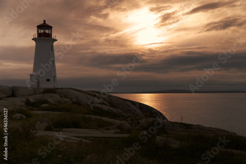 The Peggys Cove lighthouse at sunset, Nova Scotia, Canada photo