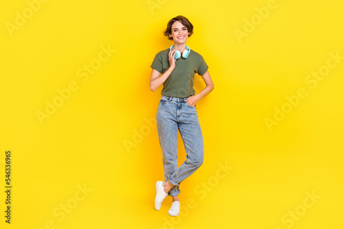 Full length photo of adorable lady stylish clothes denim rejoice buy modern device good price sale isolated on yellow color background
