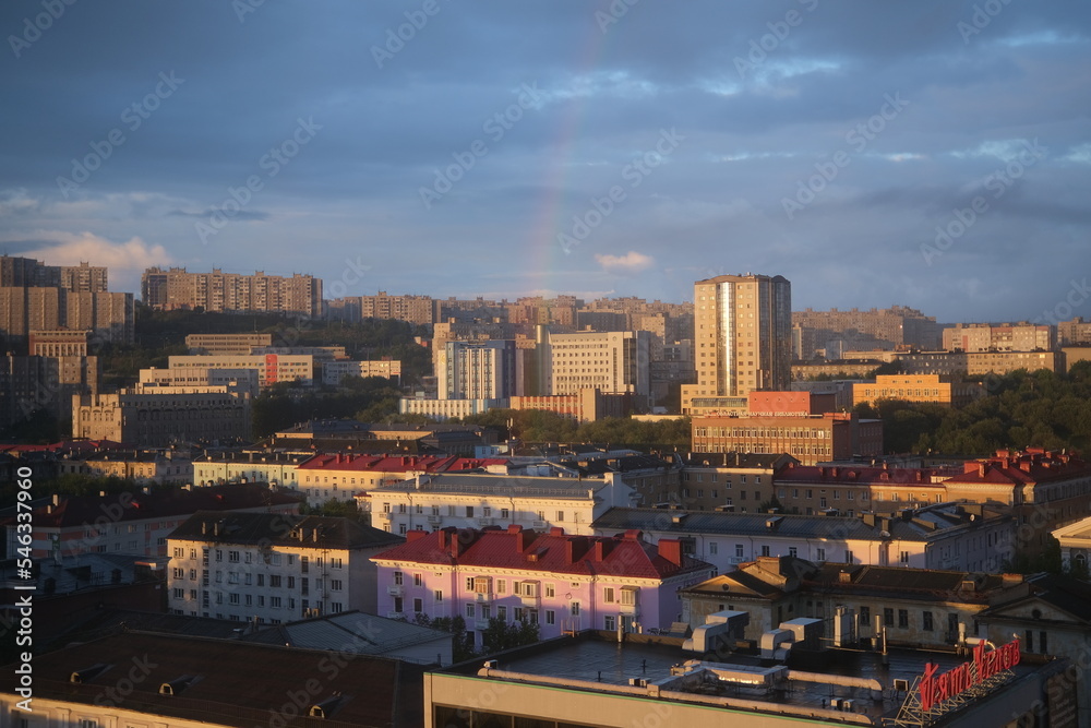 View of the city of Murmansk, rainbow after rain on a polar day, Russia, July 2022